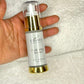 UDODI Hydrating Serum in a hand, providing anti-aging benefits while hydrating and protecting skin from environmental stress.
